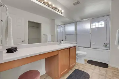 a bathroom with a sink and a toilet and a mirror at Modern Luxe Stay • Bright & Photo-Ready in Westminster