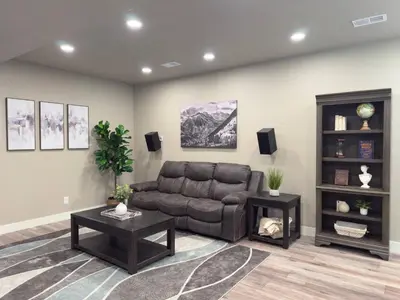 a living room with a couch and a table at Modern 5BR/3BA Luxury Home|Movie Nights & Comfort in Evans