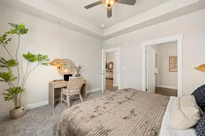 a bedroom with a bed and a desk at The Landmark with Two King Beds, Garage and Fireplace in Fort Collins