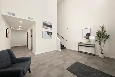 a living room with a couch and a table at The Landmark with Two King Beds, Garage and Fireplace in Fort Collins