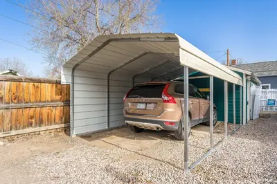 a car is parked in a garage at Kanons Kottage Downtown Retreat Near RMNP in Loveland
