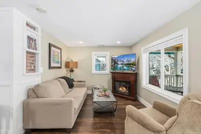 a living room with two couches and a fireplace at Kanons Kottage Downtown Retreat Near RMNP in Loveland
