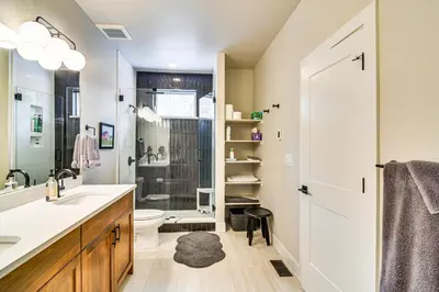 a bathroom with a sink and a toilet and a shower at Saltwater Hot Tub! Unit Near Winter Park Slopes in Fraser