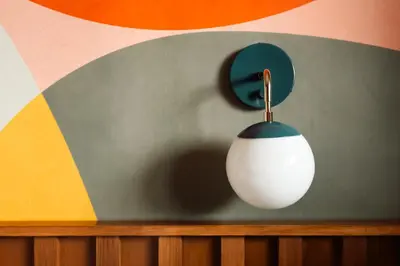 a white computer mouse hanging from a wall at La Vista Motel in Denver