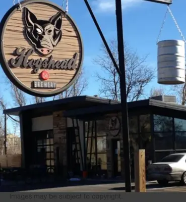 a sign for a restaurant with a dog on it at King Suite Between City and Slopes in Denver