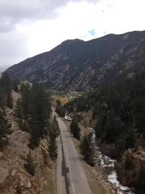a road in the middle of a mountain at King Suite Between City and Slopes in Denver