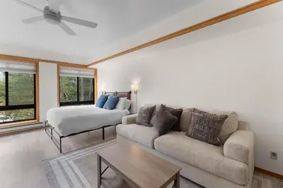 a living room with a couch and a bed at Slopeside Unit 2755 in Keystone