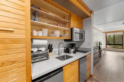 a kitchen with a sink and a microwave at Slopeside Unit 2755 in Keystone
