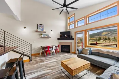 a living room with a couch and a table at La Riva Del Lago Unit 204 in Dillon