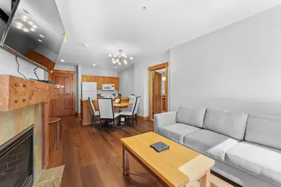 a living room with a couch and a table at Springs Unit 8865 in Keystone