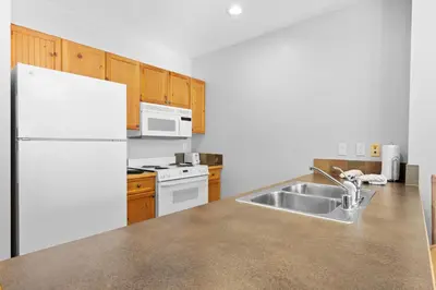 a kitchen with a white refrigerator and a sink at Springs Unit 8865 in Keystone
