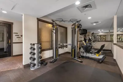 a fitness room with a gym with tread machines at Springs Unit 8865 in Keystone