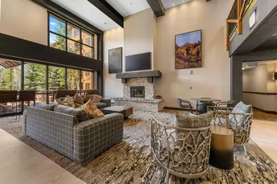 a living room with couches and a fireplace at Springs Unit 8865 in Keystone