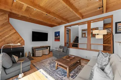 a living room with a couch and a fireplace at Tennis Townhome Unit 1321 in Keystone