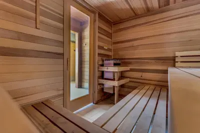a sauna with wooden walls and wooden floors at Tennis Townhome Unit 1321 in Keystone