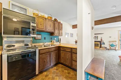a kitchen with a stove and a sink at Snowdance 204A in Keystone
