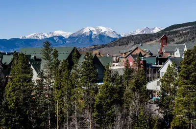 a town with trees and mountains in the background at Snowdance 204A in Keystone