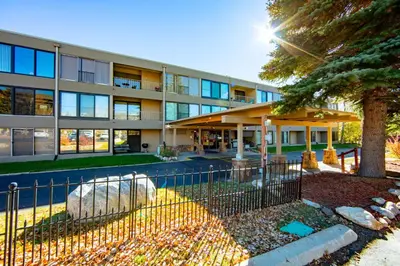 an office building with a fence in front of it at The Lodge at Lake Dillon 308 in Dillon
