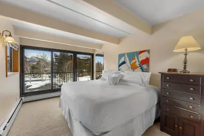 a bedroom with a bed and a large window at The Lodge at Lake Dillon 308 in Dillon