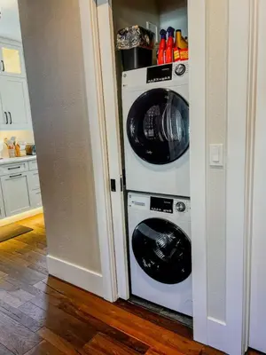 a kitchen with a washer and dryer in a room at 9 Min Walk to Pearl Street - Downtown Boulder in Boulder