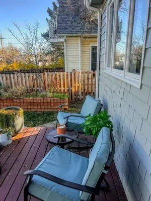 a patio with two chairs and a table on a porch at 9 Min Walk to Pearl Street - Downtown Boulder in Boulder