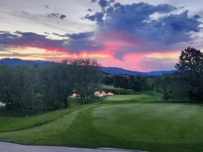 a view of a golf course at sunset at Scenic Golf Course Retreat near CSU & Estes Park! in Loveland