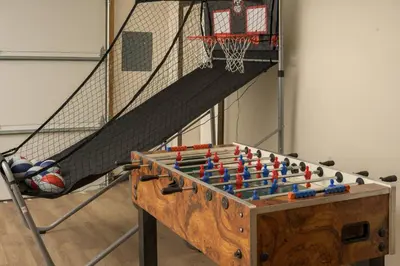 a basketball hoop and a table with a game at The Moose Hoose Cabin With Views and Game Room in Black Hawk