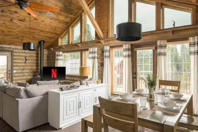 a living room with a couch and a table with the letter n at The Moose Hoose Cabin With Views and Game Room in Black Hawk