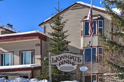a house with a sign in front of a house at 3 Mi to Skiing Walkable Dtwn Winter Park Condo! in Winter Park