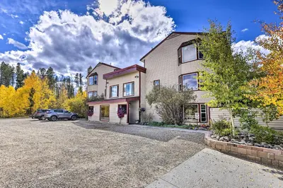 a house with a car parked in the driveway at Ski and Hike! Easy Adventuring at Winter Park Condo in Winter Park