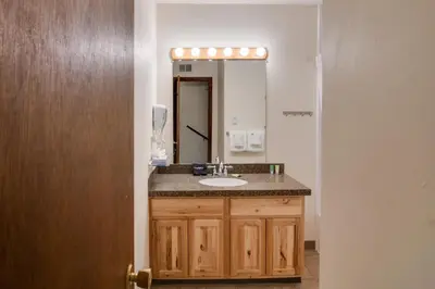 a bathroom with a sink and a mirror at Walk to Ski Shuttle! Ideal Winter Park Base Camp in Winter Park