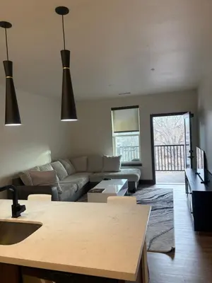 a living room with a couch and a table at Elegant Stay in Aurora