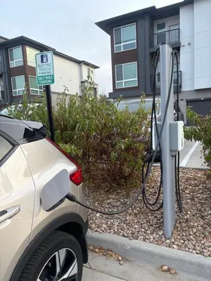 a car is hooked up to a solar charger at Elegant Stay in Aurora