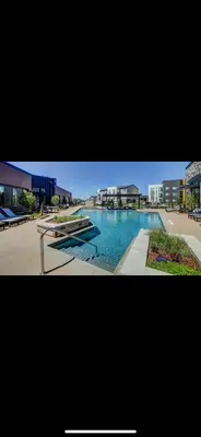 a picture of a swimming pool in a building at Elegant Stay in Aurora