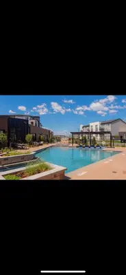 a view of a swimming pool in a city at Elegant Stay in Aurora
