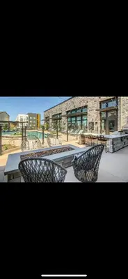 a group of chairs sitting in front of a building at Elegant Stay in Aurora