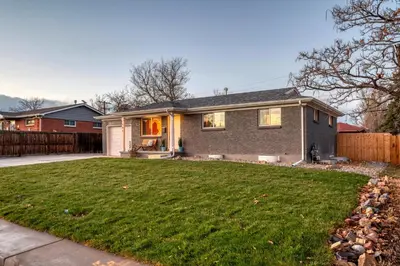 a house with a lawn in front of it at Outdoor Movie - Pingpong & Volleyball - Cozy 5BD in Denver