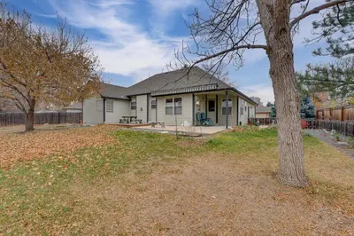a house with a tree in front of it at 4 Mi to TPC Colorado Dog-Friendly Gem in Berthoud in Berthoud