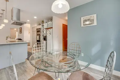a dining room with a glass table and chairs at 4 Mi to TPC Colorado Dog-Friendly Gem in Berthoud in Berthoud