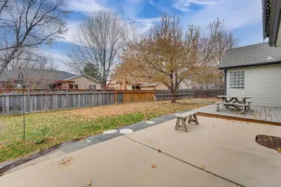 a picnic table and a bench in a yard at 4 Mi to TPC Colorado Dog-Friendly Gem in Berthoud in Berthoud