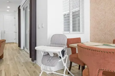 a dining room with a chair and a table at Sleeps 8, Fire pit, Near DIA & Downtown Denver in Commerce City