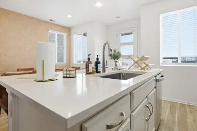 a kitchen with a sink and a counter top at Sleeps 8, Fire pit, Near DIA & Downtown Denver in Commerce City