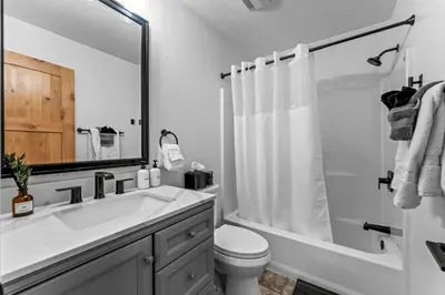 a bathroom with a sink and a toilet and a shower at Luxury Mountain Views, hot tub, peaceful retreat in Black Hawk