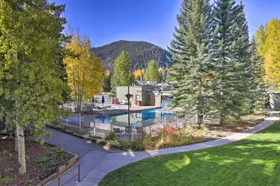 an aerial view of a yard with a swimming pool at Continental Divide Views Lakefront Keystone Condo in Keystone