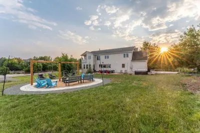 a backyard with a playground with a swing at Huge Lodge w Pickleball & More 15 mins to Golden in Arvada