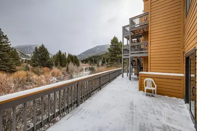 a balcony of a building with a chair on it at 2963 Key Condo condo in Keystone