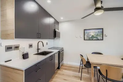 a kitchen with a sink and a table with chairs at 2963 Key Condo condo in Keystone
