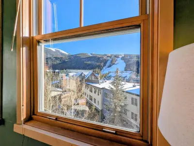 a window with a view of a mountain at Silver Mill 8299 by SummitCove Lodging in Keystone