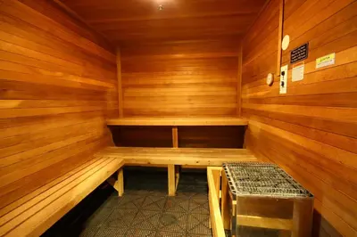 a wooden sauna with a bench in it at Silver Mill 8299 by SummitCove Lodging in Keystone