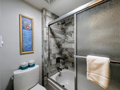 a bathroom with a shower and a toilet and a sink at Flying Dutchman 1109 by SummitCove Lodging in Keystone